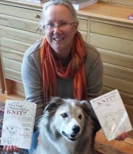 Designer Meg Warren holding the Defarge books